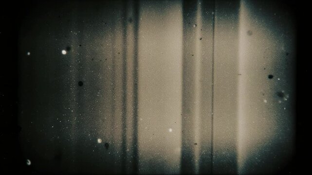 Grainy Super 8 film strip texture with light leaks and dust particles during a subtle zoom effect