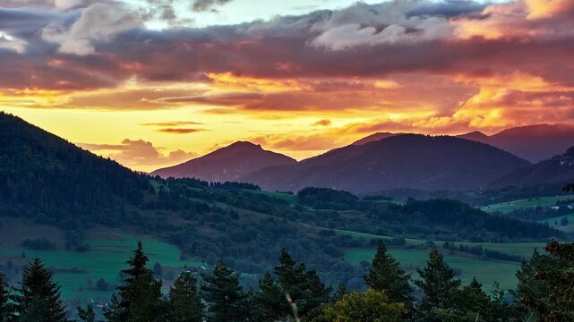 Timelapse of Colorful Sunset Clouds Moving Over Mountain Landscape at Twilight