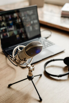 Microphone on the air and headphones for video conference calling on laptop computer