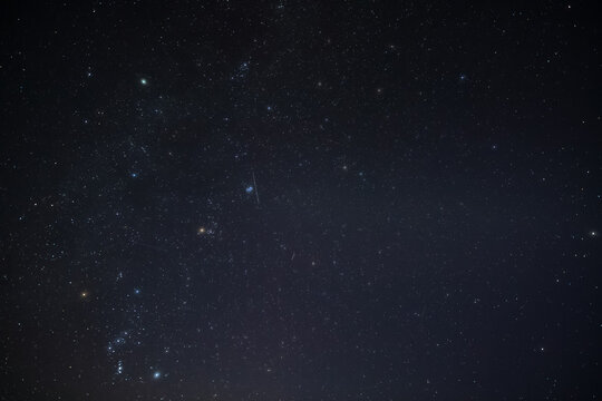 Orion constellation, zodiacal light and Milky Way stars on a dark countryside skies.