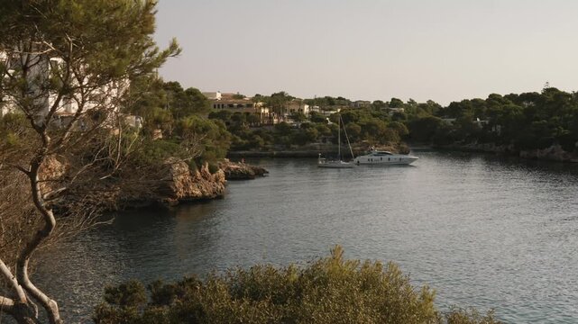 Cala Esmeralda turquoise cove in Mallorca, sun loungers and umbrellas along the shoreline