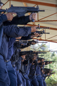 Uruapan, Michoacan, Mexico - 14 November 2023: View of police officers participating in a shooting training exercise at a firing range.