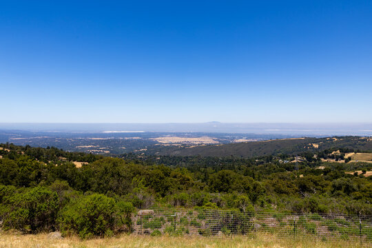 Vista over Californian landscape with hills valley and clear blue sky from elevated point