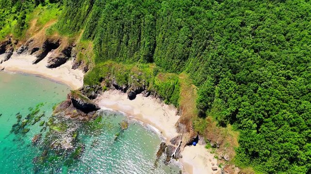 Wide aerial view of a secluded sandy beach with clear turquoise water, rocky shoreline and dense green vegetation along Bulgaria&rsquo;s southern Black Sea coast.