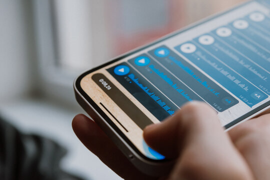 A person recording voice messages in a messenger.