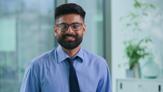 Portrait happy smiling Arabian businessman working in office Muslim business man work in company joyful Indian executive in glasses bearded stylish formal male employer startup manager smile indoors