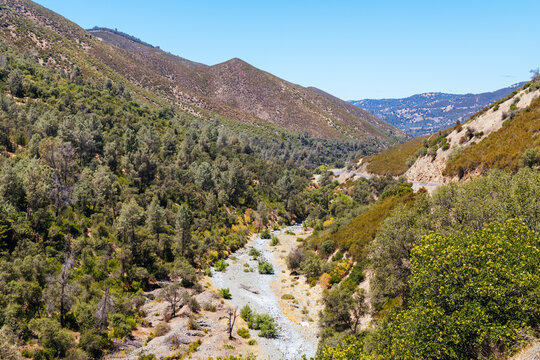 Scenic mountain landscape with a dry rocky riverbed in Tuolumne County California.