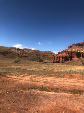 Scenic view of landscape against blue sky