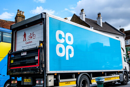 Close-Up Of A Branded Co-op Supermarket Delivery Lorry With Hydraulic Tail Lift, Displaying Cyclist Warning Signs,