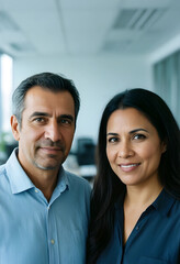 Obraz premium Diverse business professionals, mature man and woman smiling in a modern office setting, corporate leadership and teamwork