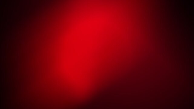 A smooth gradient background featuring a deep and vibrant crimson red color