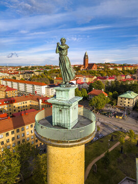 Aerial view of Sjomanstornet featuring a bronze statue of a woman atop a brick tower with a copper observation deck overlooking the cityscape of Goteborg, Vastra Gotalands lan, Sweden.