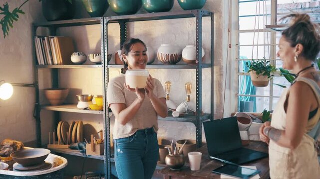 Women, pottery store and customer purchase or shopping ceramic, skill conversation or pot choice. Shop owner, client and service talking or creative decision at small business for sale, diy or studio
