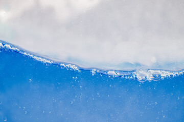 Closeup Transparent blue clear water surface texture with ripples. Abstract​ of​ surface​...