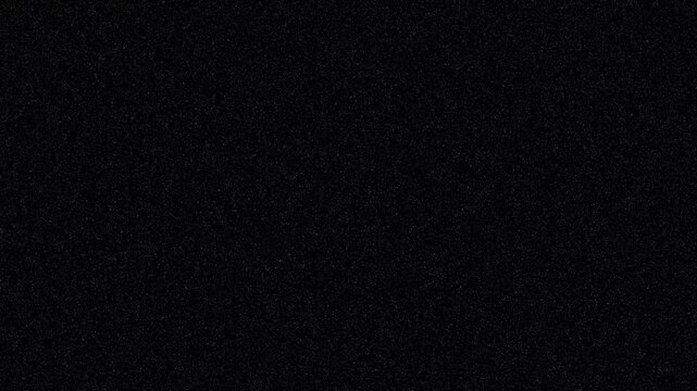 A solid deep black background with subtle noise and uniform dark texture