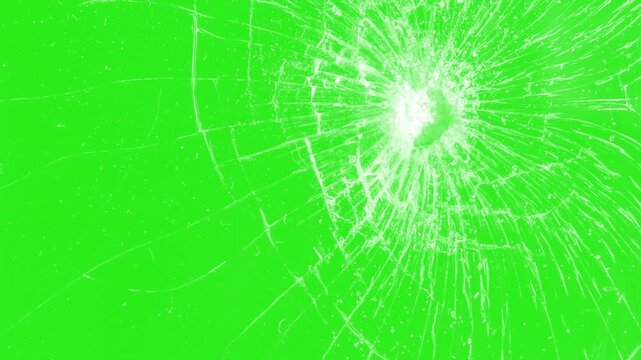 Broken cracks glass fracture effect texture isolated abstract background. Broken glass on black background. Glass is breaking. Dynamic explosion of a glass shattering on green screen  