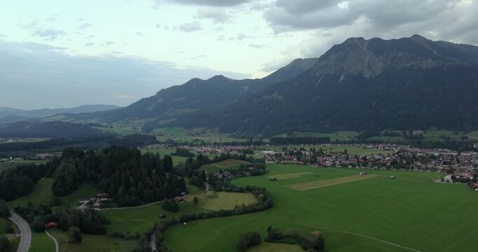 Drone panorama over Oberstdorf and surrounding Bavarian Alps at dusk