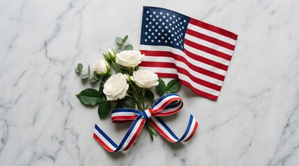 Obraz premium A beautiful patriotic floral arrangement features a gracefully draped american flag alongside elegant white roses set on a stunning marble surface for