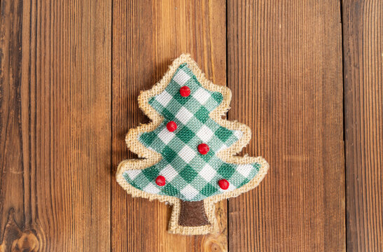 shape of pine tree christmas decoration on wooden background