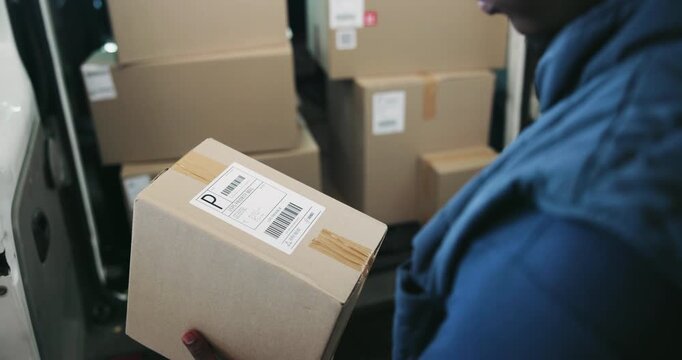 Hands, scanner and man with boxes for delivery, supply chain and logistics with cargo. Person, courier and employee with equipment, cardboard and business with ecommerce and parcel for barcode check
