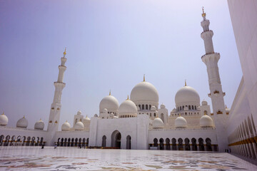 Wide Angle View of Sheikh Zayed Grand Mosque Courtyard with Domes and Minarets in Abu Dhabi, UAE © bumsoo