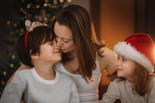 Portrait of mother son daughter celebrate christmas together