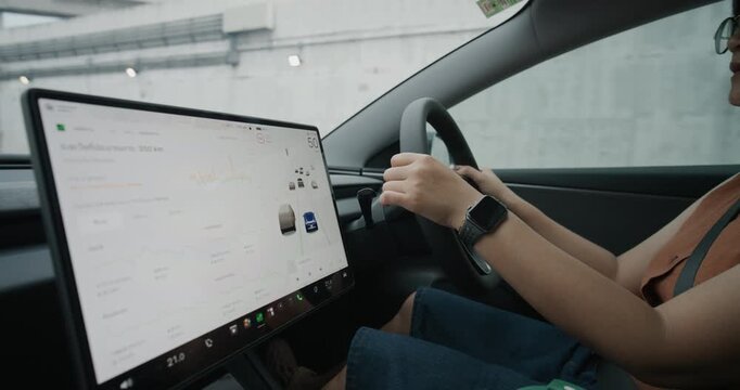 Smart business woman drive EV car use GPS navigator transport technology