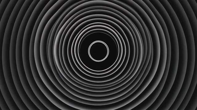 Hypnotic concentric spiral tunnel pattern in monochrome shades of gray and black