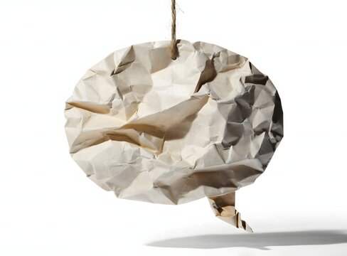 Crumpled paper speech bubble on string.