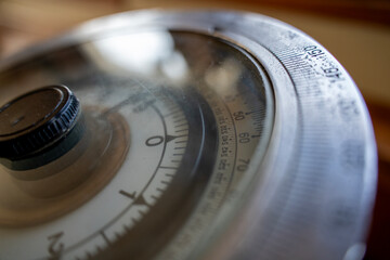 Close up of vintage nautical gyrocompass navigation instrument with circular degree scale dial on ship bridge indoors. © Marina
