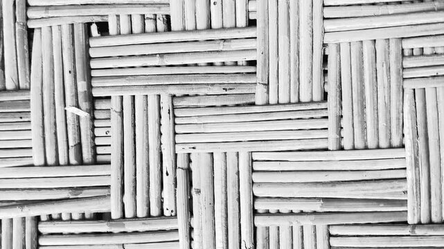 Monochrome woven bamboo textured pattern background in black and white