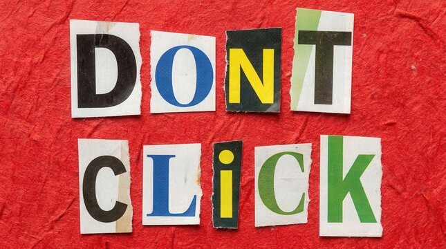 Dont click ransom note or warning sign made of cut out magazine letters on a textured red background.