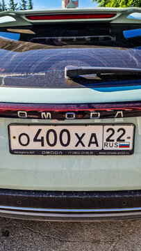 Rear view of the Omoda E5 electric SUV with a Russian license plate (Region 22) in Barnaul; a modern Chinese crossover, Altai Region, Siberia, Russia 25.05.25