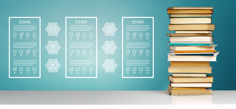 E learning setup with exam papers and stack of books on a table