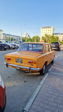 Yellow Lada VAZ-2101 sedan with a Soviet license plate parked by the roadside in Barnaul&mdash;a legendary classic Zhiguli from the USSR&mdash;Altai Region, Siberia, Russia 25.05.25