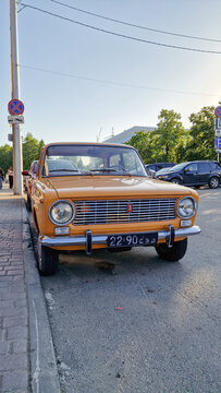 Yellow Lada VAZ-2101 sedan with a Soviet license plate parked by the roadside in Barnaul&mdash;a legendary classic Zhiguli from the USSR&mdash;Altai Region, Siberia, Russia 25.05.25