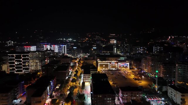 Aerial drone view of Alanya, Turkey at night, featuring the illuminated Mediterranean coastline, city lights, beachfront, urban landscape and night resort atmosphere.
Night aerial view of Alanya on th