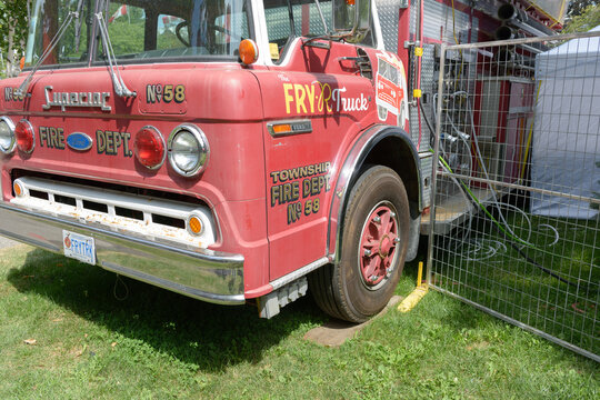 front and side of the FRY-R-Truck, a retired heavy-duty fire truck, now a mobile food wagon, near Bell Soundstage at the Bandshell, Exhibition Place, Toronto (22 August 2026)