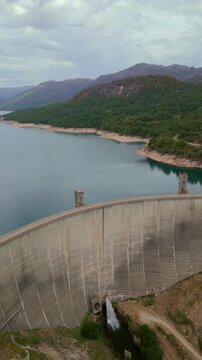 Vertical aerial drone footage of Vilarinho das Furnas dam and reservoir in Peneda-Geres National Park, Portugal