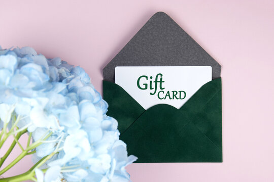 Gift card in a green envelope on a light background