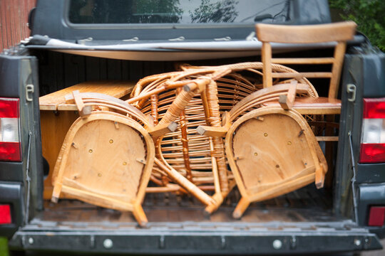 retro chairs loaded into a pickup