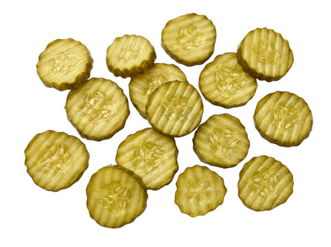 A pile of sliced dill pickles scattered on a white background.