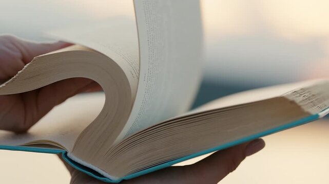 Woman Flips Through Pages Of Old Paper Book On Sunset Background. Aesthetics scene. Education, science, nature concept.