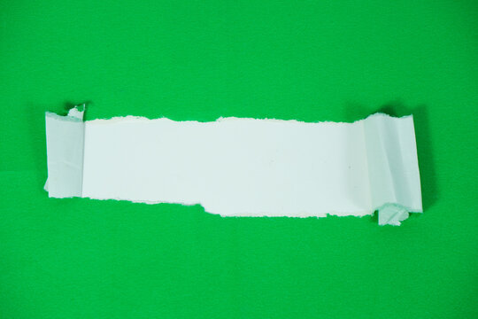 A white paper layer revealed beneath a torn green sheet. A torn paper section with a white background area for text. The torn green paper layer peels back, exposing the white layer underneath.
