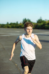 Fototapeta premium Teeange Boy In A Sleeveless Top And Shorts