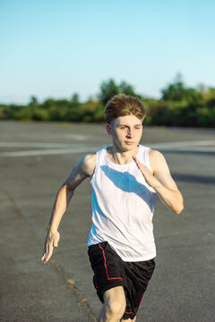 Teeange Boy In A Sleeveless Top And Shorts