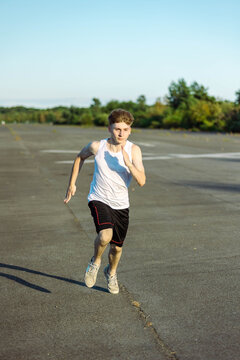 Teeange Boy In A Sleeveless Top And Shorts