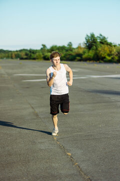 Teeange Boy In A Sleeveless Top And Shorts
