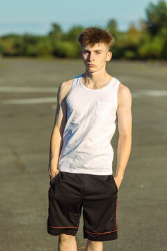 Teeange Boy In A Sleeveless Top And Shorts