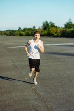 Teeange Boy In A Sleeveless Top And Shorts